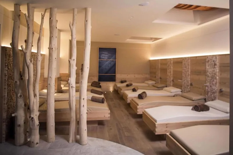 Quiet wellness lounge with reclined beds and soft light